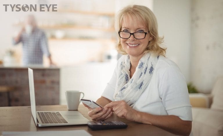 Person smiling and how blue lights electronics and cause digital eye strain