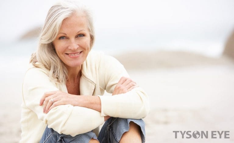 a woman in white on the beach
