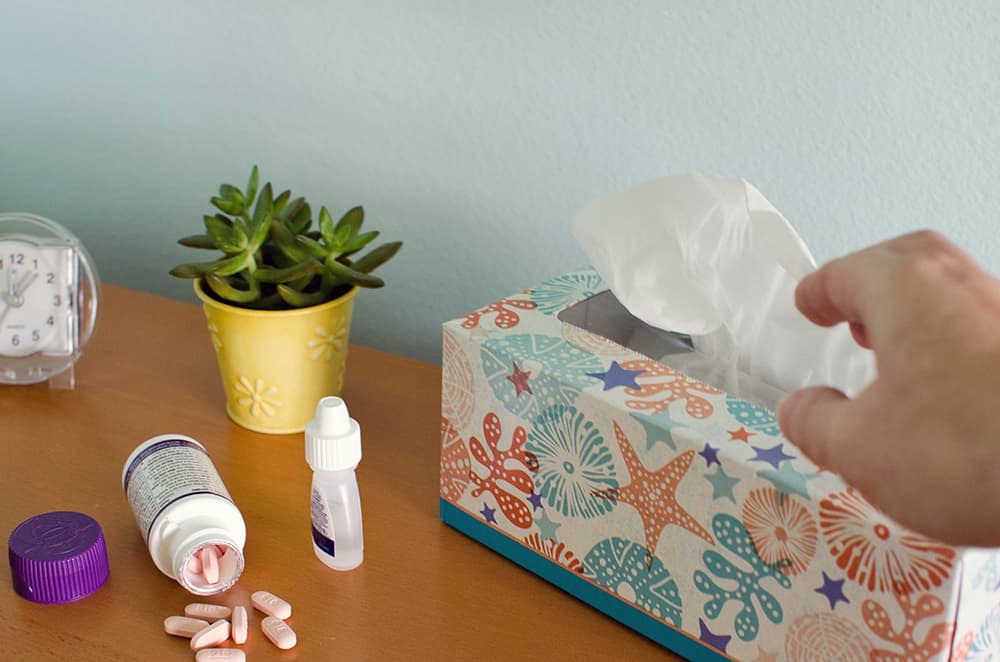 A man reaching for tissues