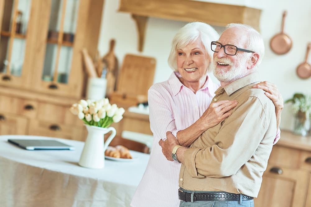 Senior couple embracing and smiling