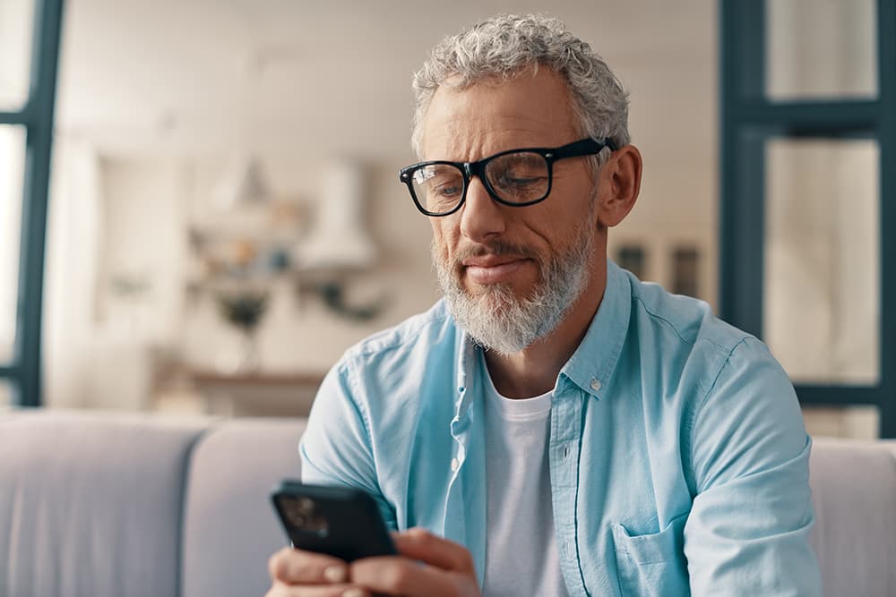A man looking at his phone