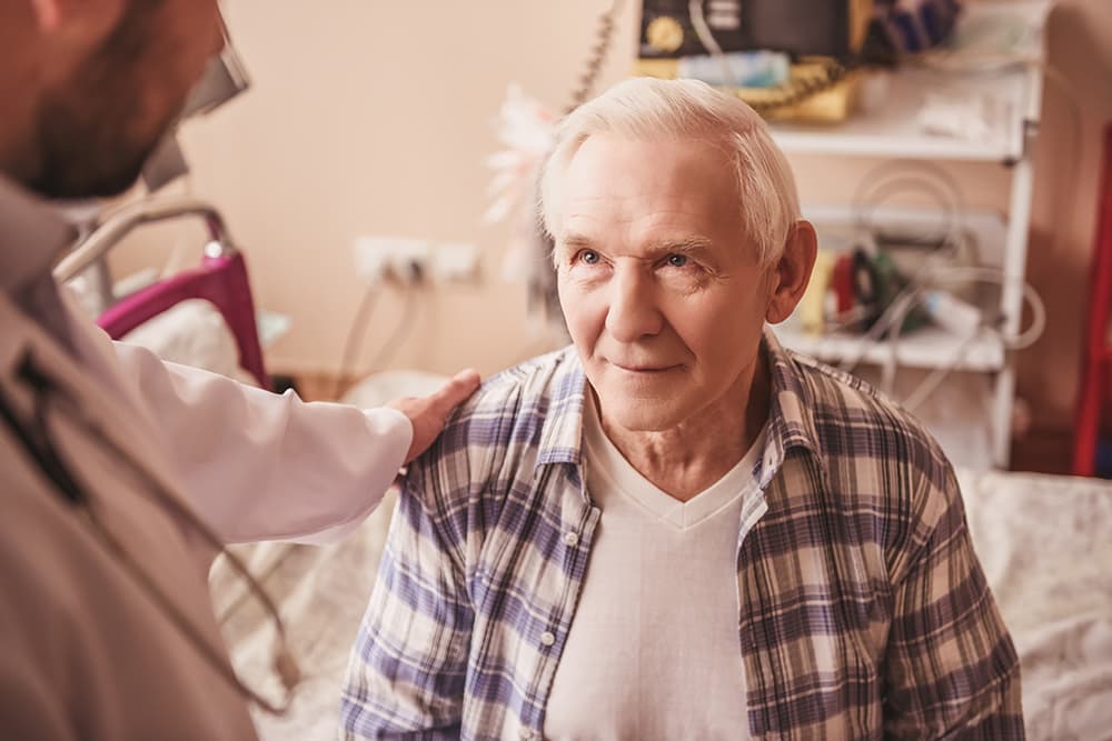 A Senior man talking to his doctor