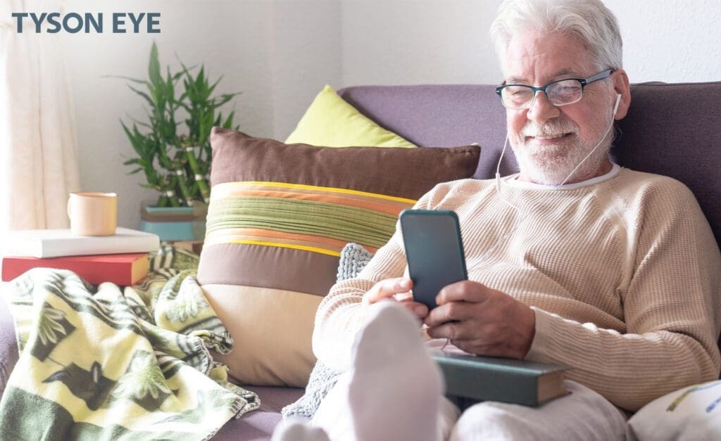 a person looking at their phone showing what screen time does to your eye health