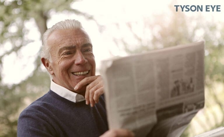 a person reading a newspaper navigating life through dry eye
